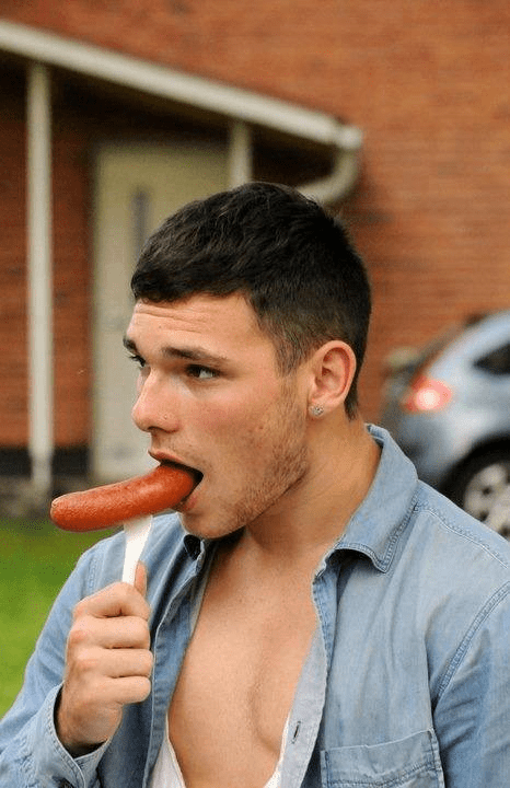 handsome, hunk, man eating hot dog