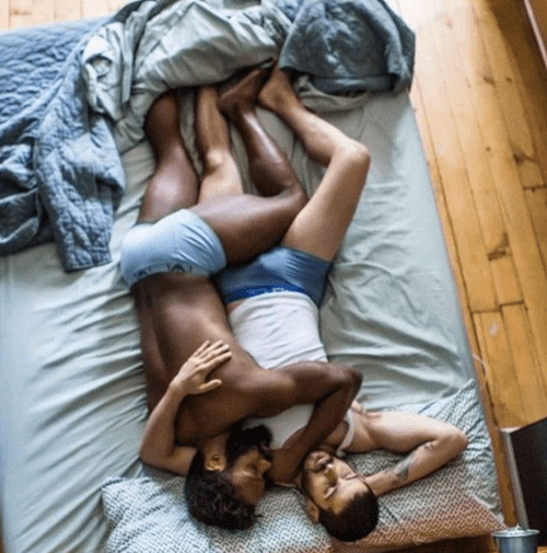 men in bed together