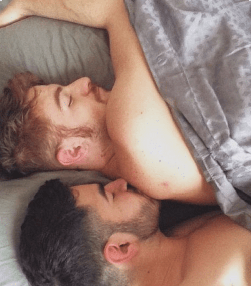 men in bed together