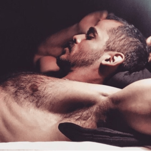 handsome man in bed, man stretching