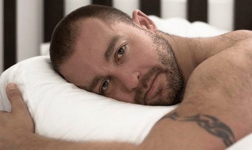 handsome man in bed