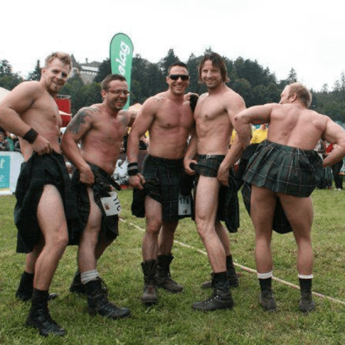 handsome group of men wearing kilts
