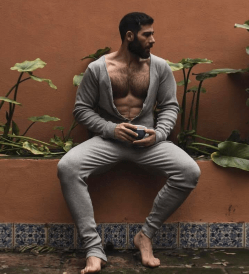 sexy guy in a onesie, handsome, hunk, hairy guy with coffee