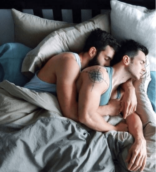 men in bed together