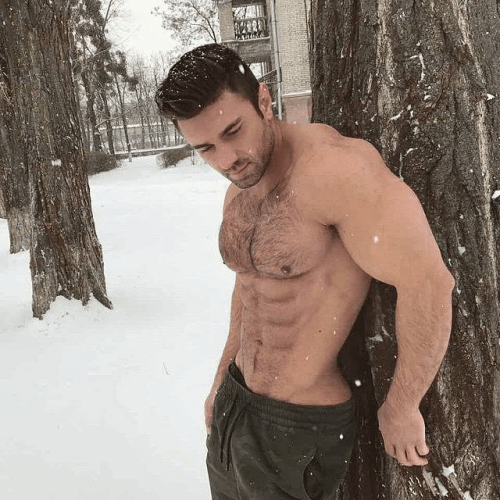 handsome, hunk, shirtless guy in the snow