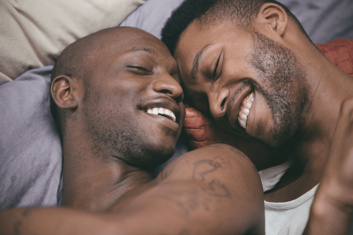 gay men of color, black gay couple, men in bed together, men cuddling