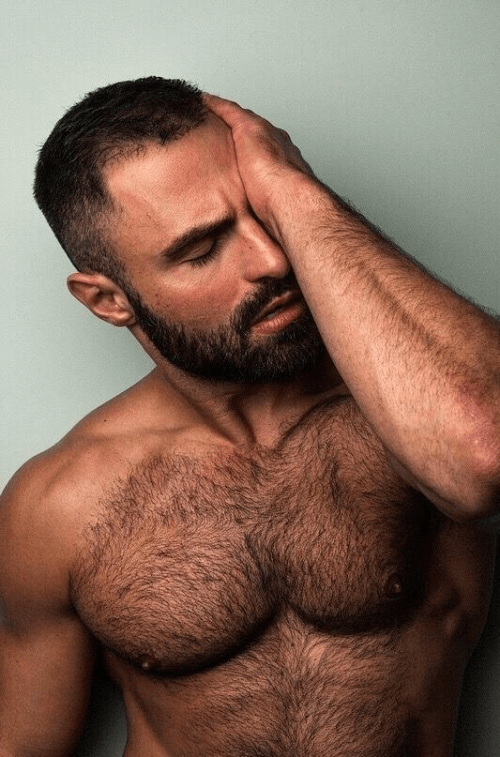 handsome man waking up, hairy chest