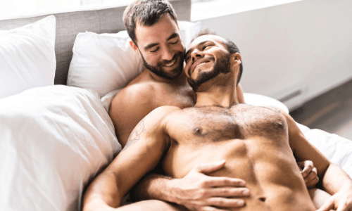 men in bed embracing, handsome men in bed, hairy