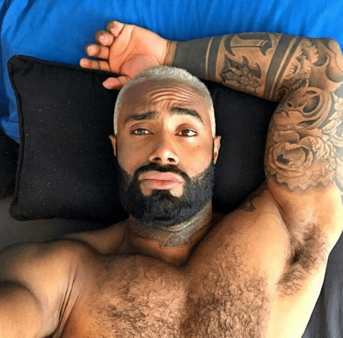 handsome black man in bed