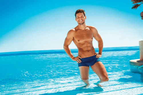 hunk in a bathing suit, speedo, blue water