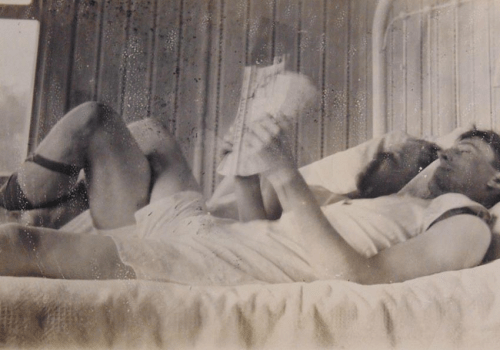 men reading in bed